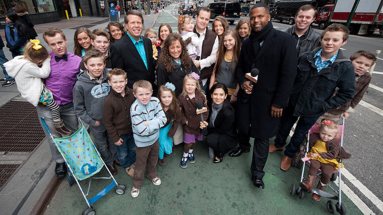 photo of the duggar family standing in the street