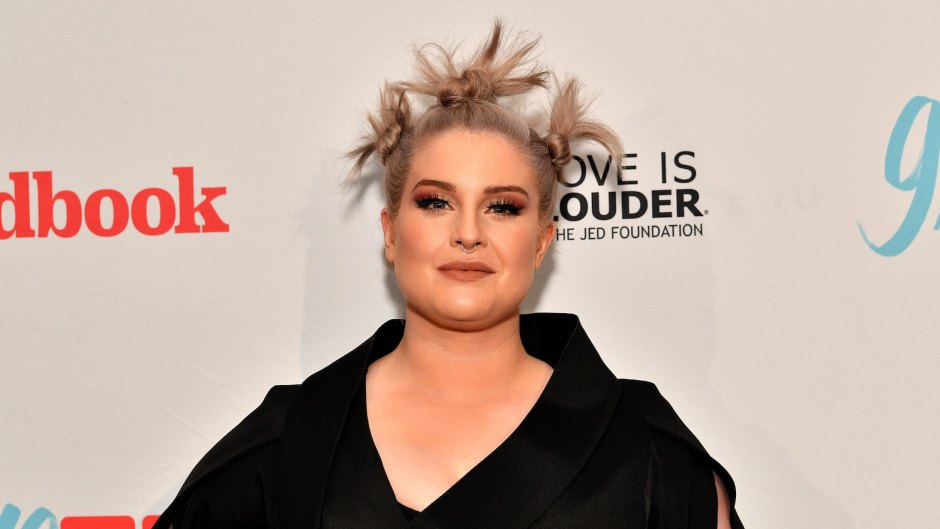 Kelly Osbourne with a weird hairstyle, wearing black at an event