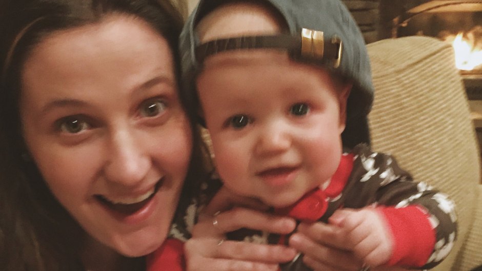 Tori Roloff Holds Up Jackson Wearing A Big Baseball Hat