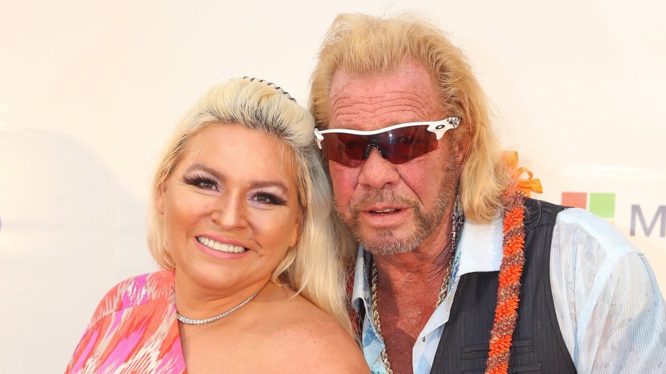 Beth Chapman wearing a pink dress with Dog Duane Chapman wearing sunglasses