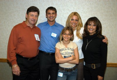 Britney Spears with her family, wearing a white shirt