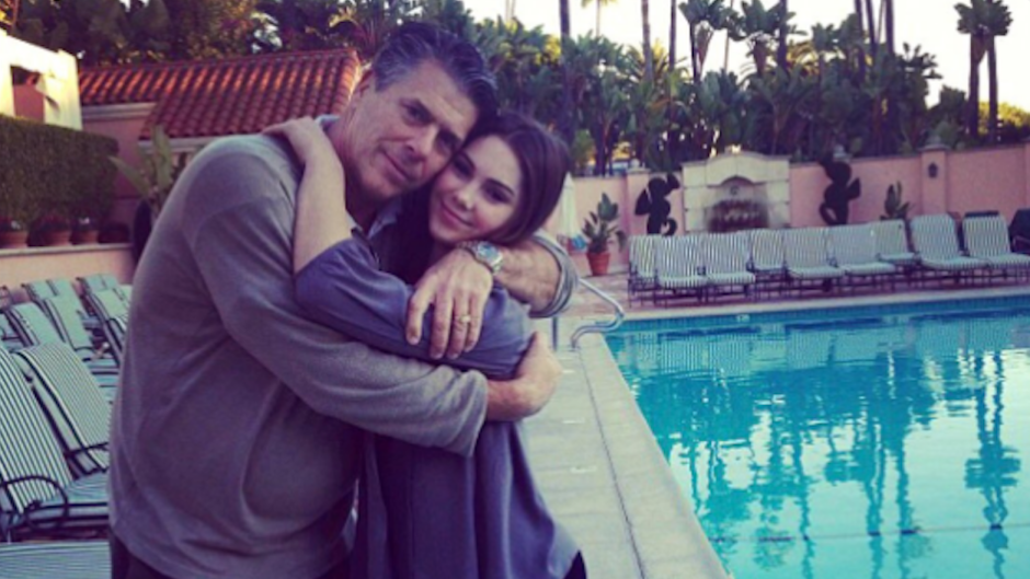 McKayla Maroney with her dad by a pool