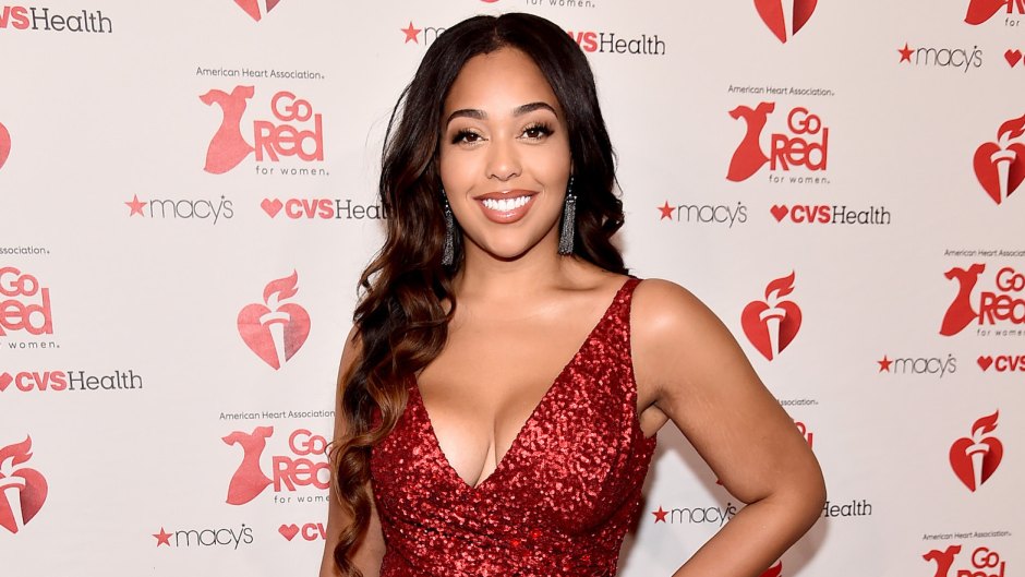 Jordyn Woods wearing a red dress