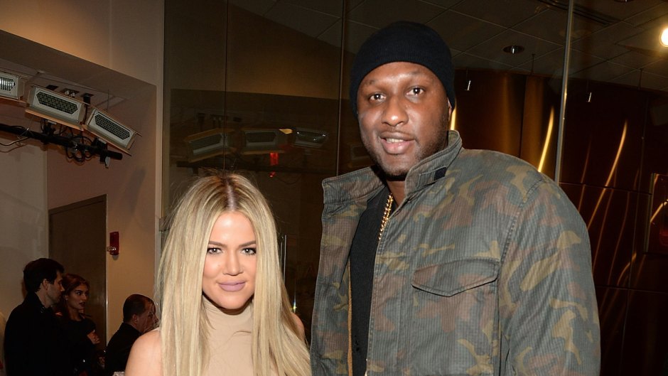 Khloe Kardashian With Blonde Hair and Lamar Odom Wearing a Black Hat and Army Sweatshirt