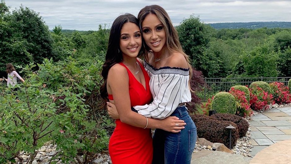 Melissa Gorga Wearing Jeans While Hugging Her Daughter In a Red Dress