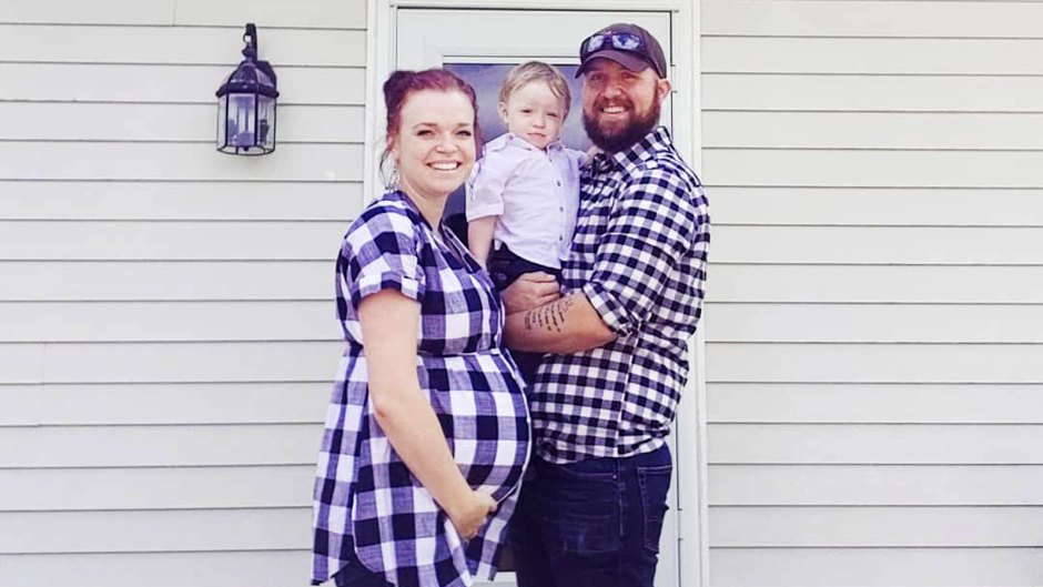 Pregnant Maddie Wears Plaid Smiling and Holding Pregnant Belly as Caleb also Wears Matching Plaid Smiling and Holding Axel