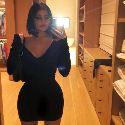 Kylie Jenner Wearing a Black Dress Taking a Mirror Selfie
