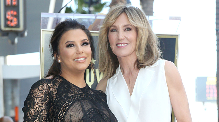 eva longoria wears a black lace dress and felicity huffman wears a white v-neck top on the red carpet at eva's Hollywood Walk of Fame ceremony in Los Angeles in April 2018 eva longoria defends desperate housewives costar felicity huffman