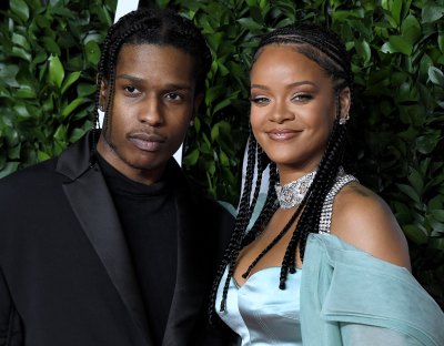 rihanna and asap rocky pose together on the 2019 fashion awards red carpet