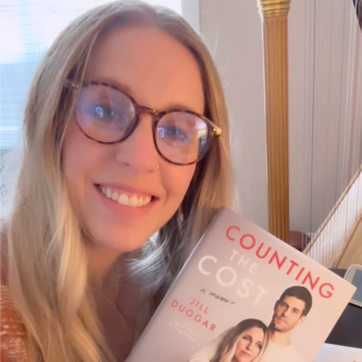 Jill Duggar holding her book Counting the Cost
