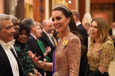 Kate Middleton wearing a crown and a formal gown